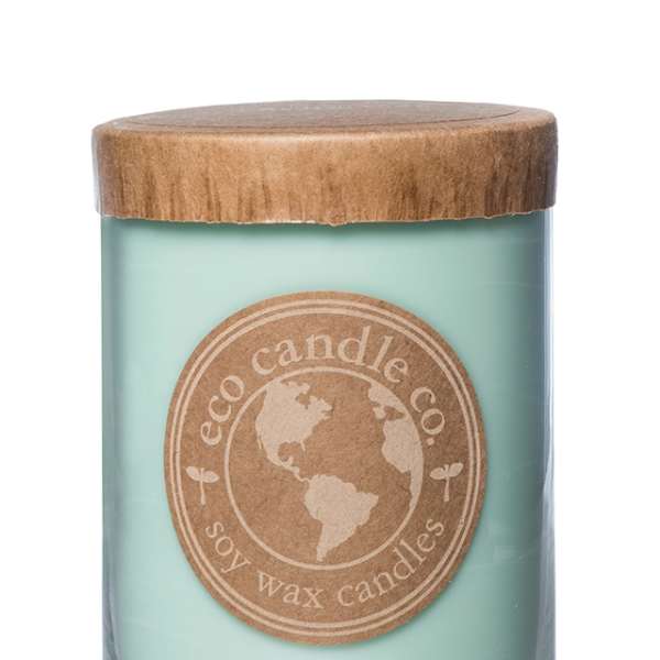 Mint-green candle in a glass jar with a wooden lid