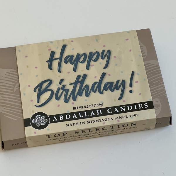 Birthday candy gift box on a white surface