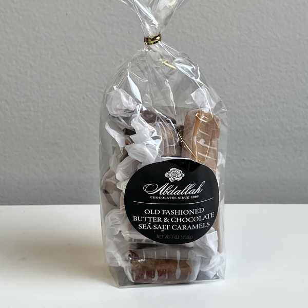 Bag of wrapped sea salt caramels with a black label