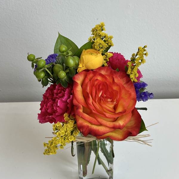 Colorful mixed bouquet in a clear glass vase