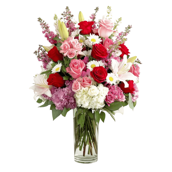 Mixed bouquet of roses, lilies, daisies, and hydrangeas in a clear glass vase
