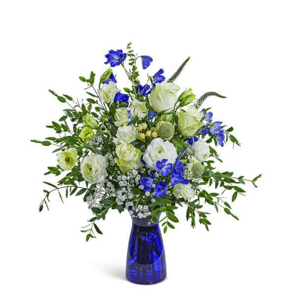 Blue and white floral arrangement in a cobalt glass vase