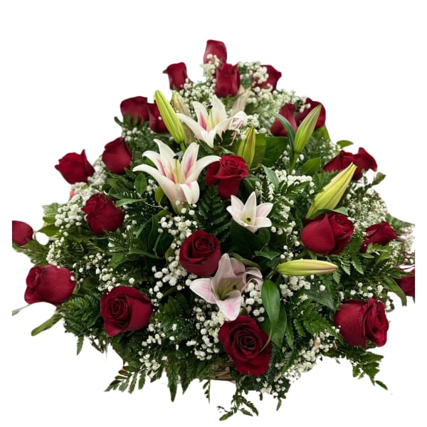 Red roses and white lilies arranged in a low bouquet