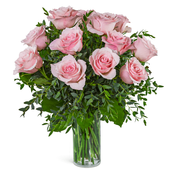 Pink roses arranged in a clear glass vase