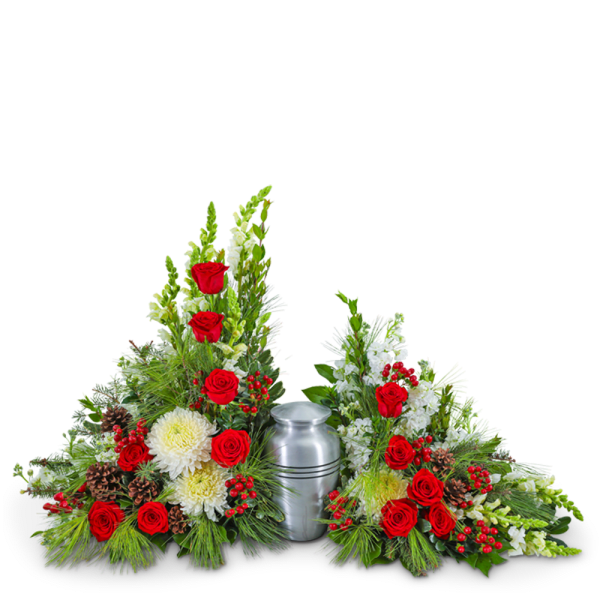 Sympathy urn arrangement with red roses, white flowers, and pinecones around a silver urn
