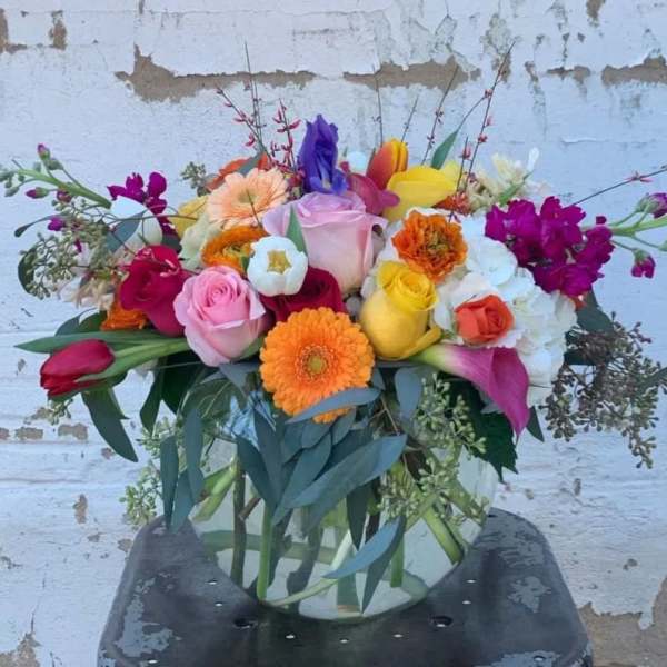 Colorful mixed bouquet in a clear glass vase