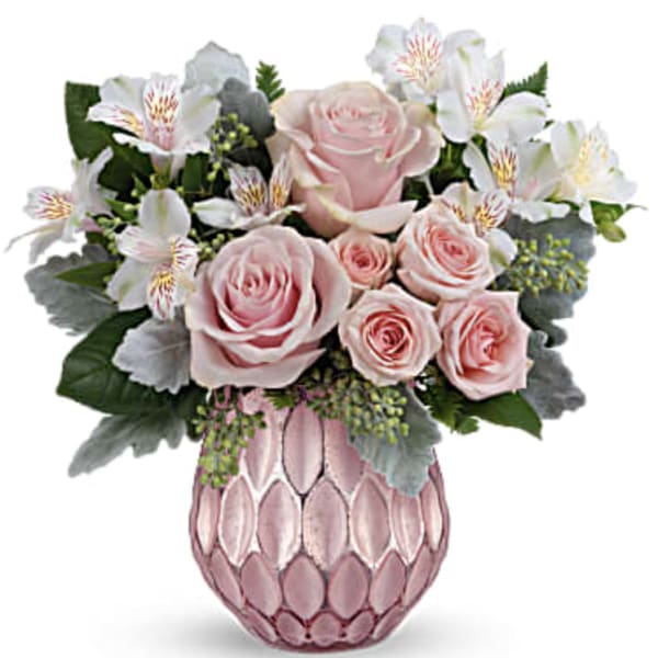 Pink roses and white alstroemeria in a pink textured vase