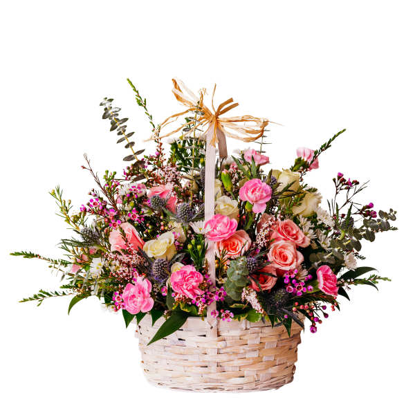 Basket of pink and cream flowers with a raffia bow
