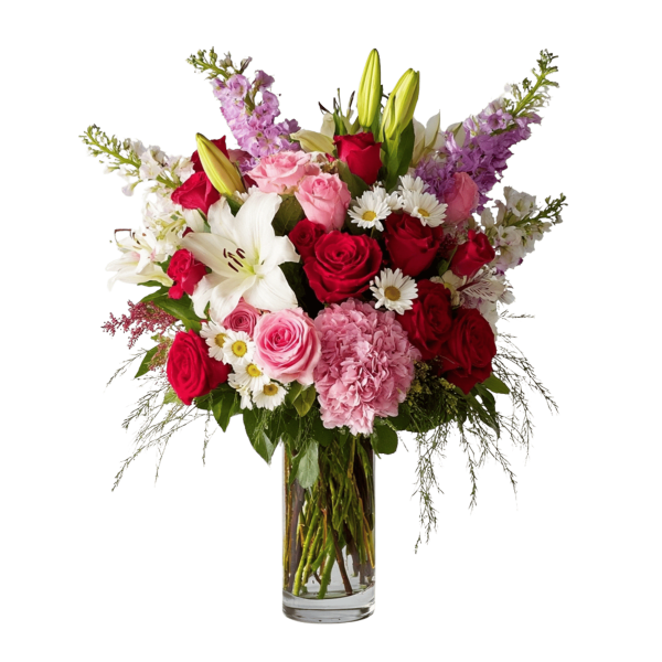 Mixed bouquet of red and pink roses with lilies in a clear glass vase