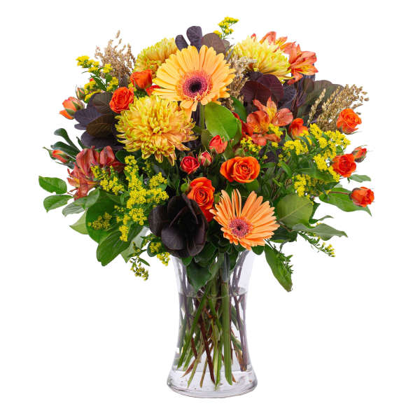 Mixed orange and yellow bouquet in a clear glass vase