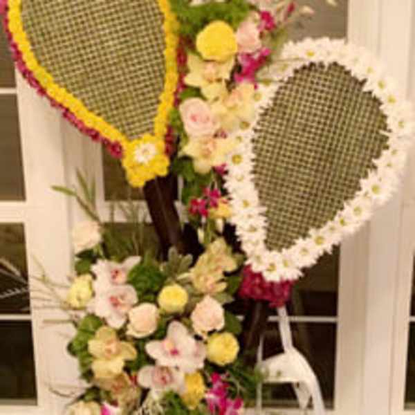 Standing floral display with two teardrop frames and pastel flowers