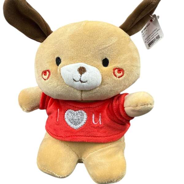 Plush dog toy wearing a red shirt with heart embroidery