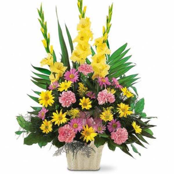 Yellow and pink floral arrangement in a square vase