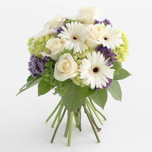 Bouquet of white roses and gerbera daisies with purple accents