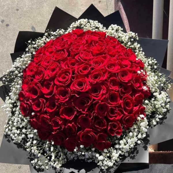 Large bouquet of red roses with white baby's breath