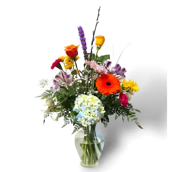 Colorful mixed bouquet in a clear glass vase