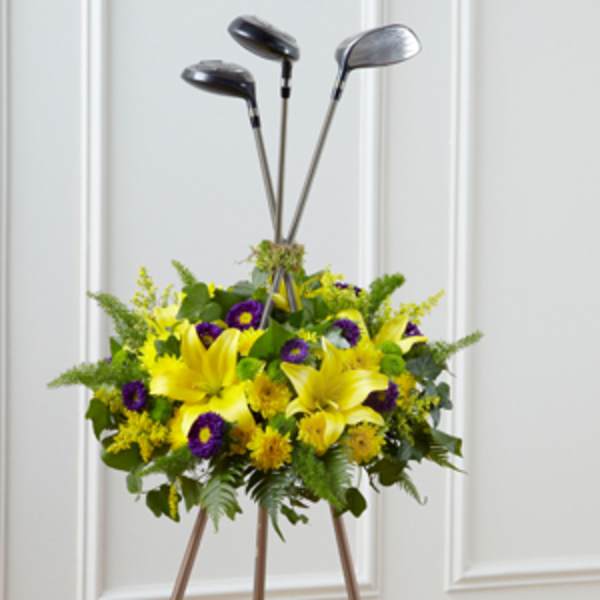 Yellow and purple floral arrangement with golf clubs