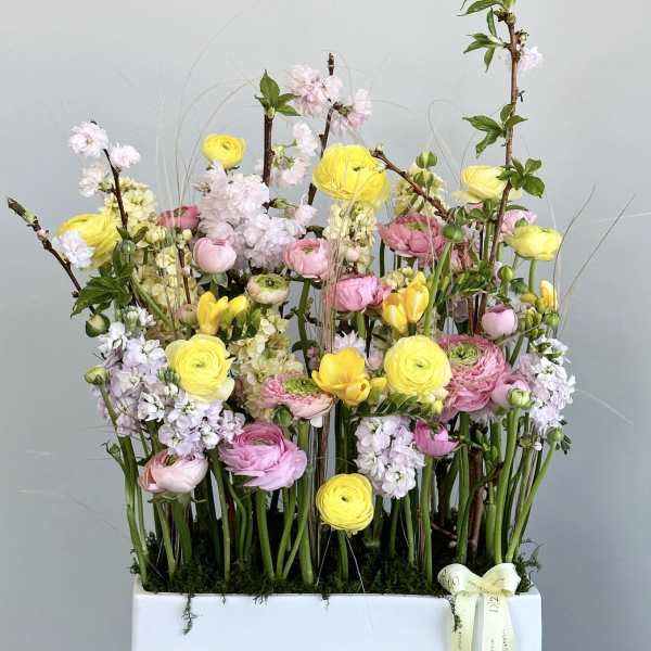 Tall mixed bouquet in a white rectangular box with pink and yellow blooms