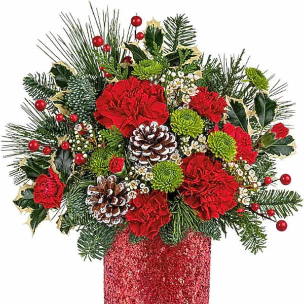 Christmas arrangement with red carnations in a glittery red vase