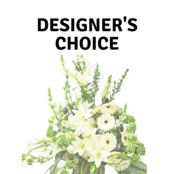 White floral funeral basket with lilies and green accents