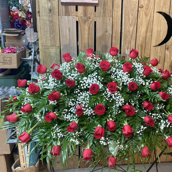 Large arrangement of red roses with white baby's breath