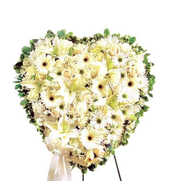 Heart-shaped white floral standing spray with ribbon
