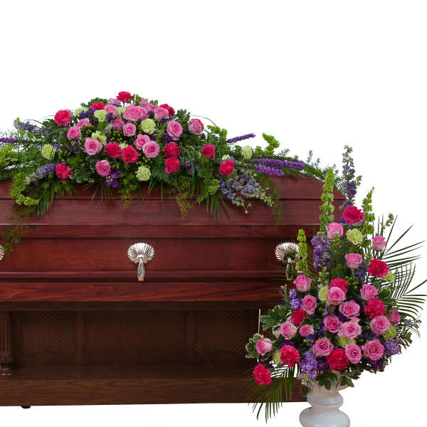Casket spray and matching standing floral sprays in pink, purple, and green