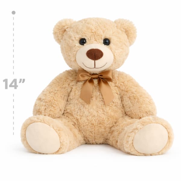 Beige teddy bear with a brown ribbon bow