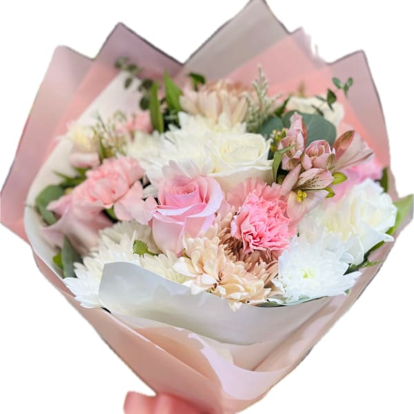 Bouquet of pink and white flowers wrapped in pastel paper