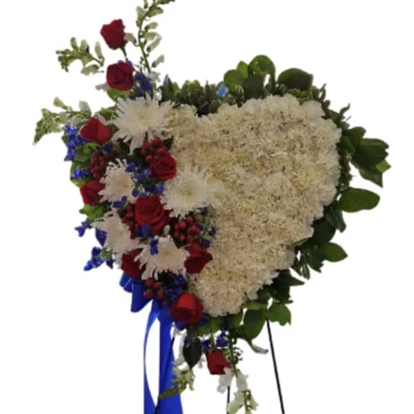 Heart-shaped floral standing spray with red roses and white blooms