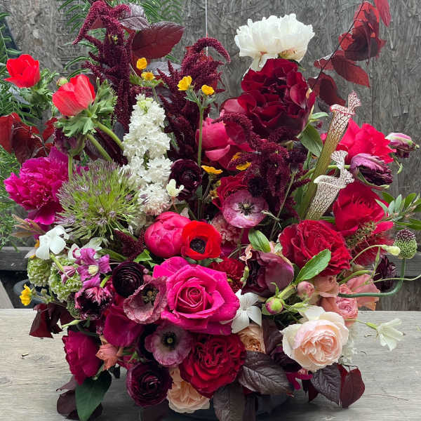Large mixed bouquet with red, pink, white, and burgundy flowers