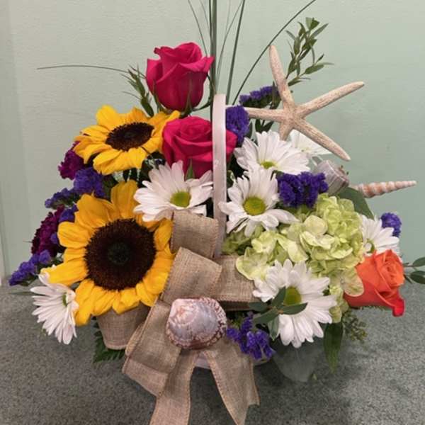 Bouquet with sunflowers, roses, daisies, and a starfish accent