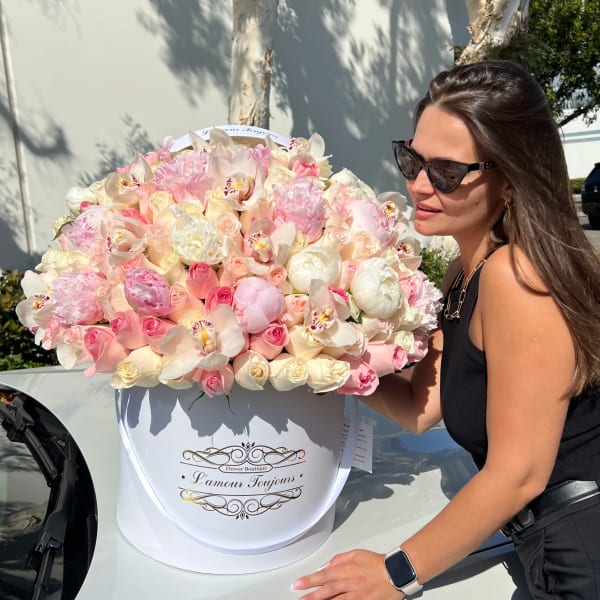 Large pastel flower box with pink and white blooms