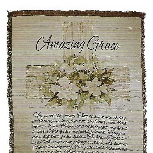 Decorative wall hanging with white flowers and the words Amazing Grace