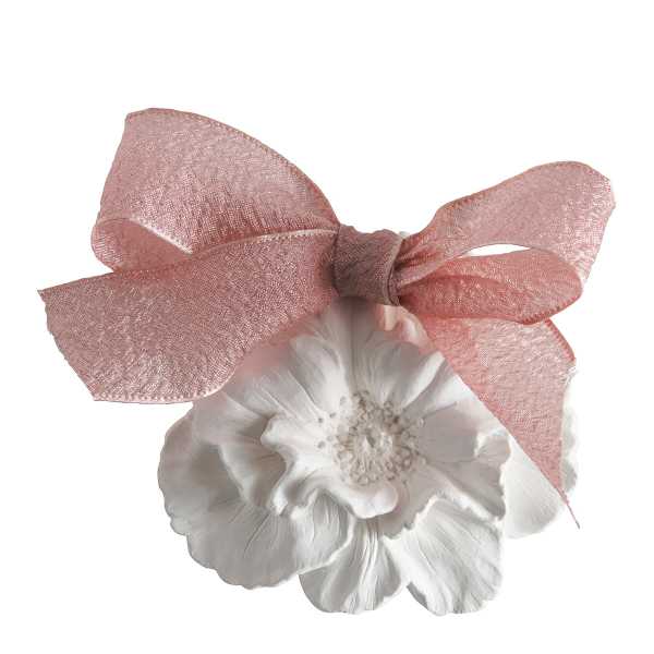 White flower with a large pink ribbon bow