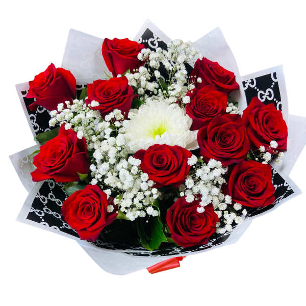 Bouquet of red roses with white filler flowers and a white bloom