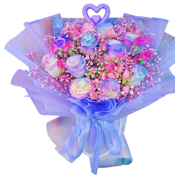 Bouquet of pastel roses with pink filler flowers and purple wrapping