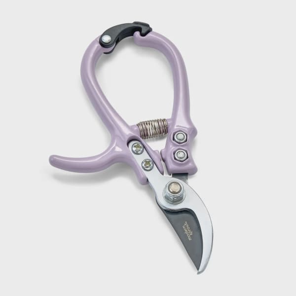 Lavender pruning shears with a curved metal blade on a white background