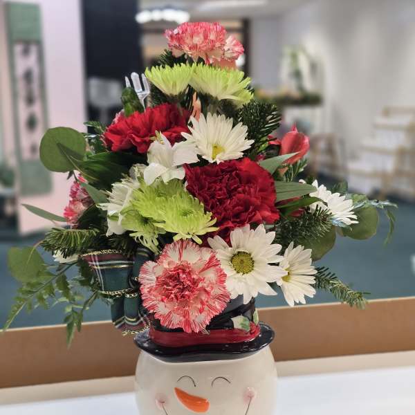 Mixed bouquet in a snowman ceramic container