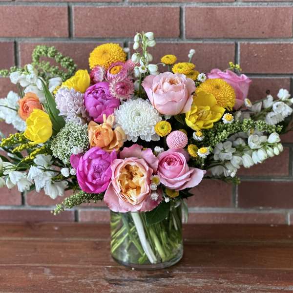 Colorful mixed bouquet in a clear glass vase