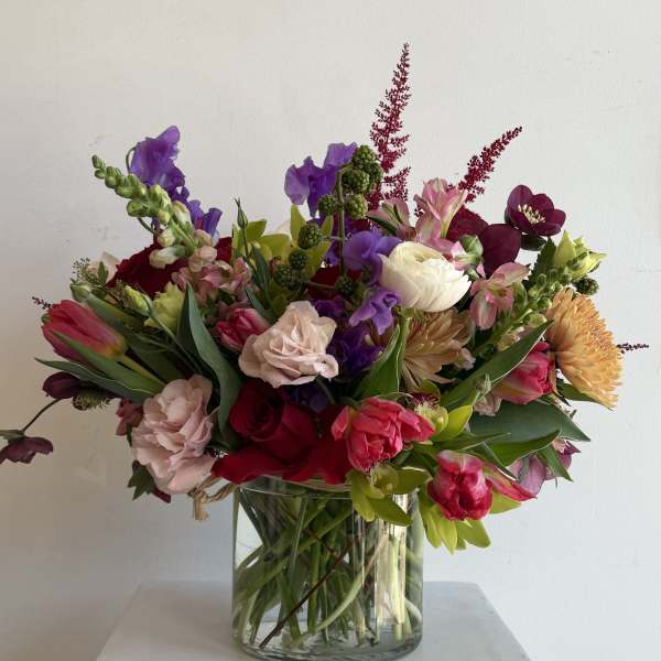 Colorful mixed bouquet in a clear glass vase