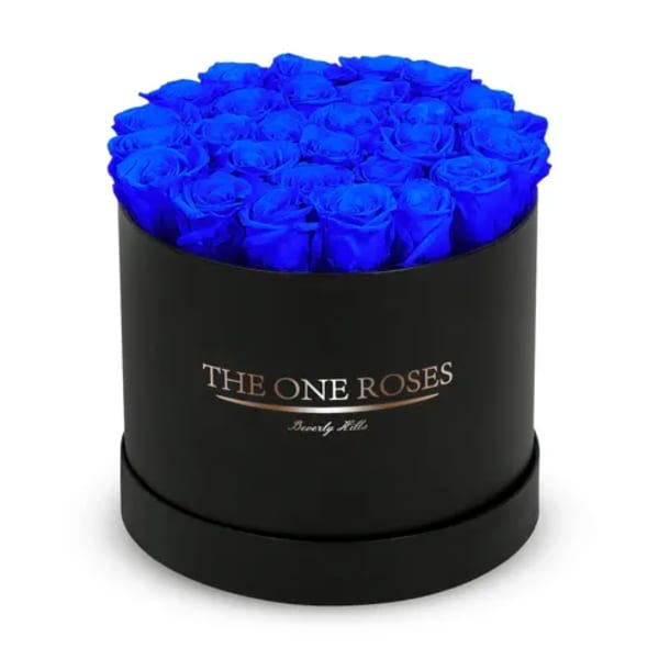 Blue roses in a black round box