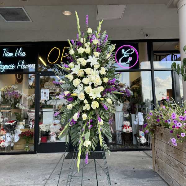 Tall standing floral spray with white roses and lilies