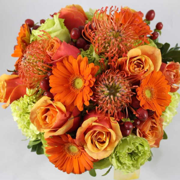 Orange and peach bouquet with gerbera daisies and roses