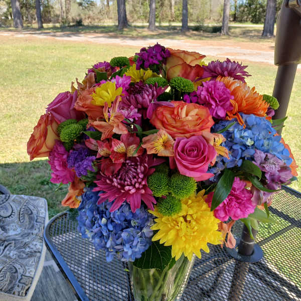 Colorful mixed bouquet in a clear glass vase