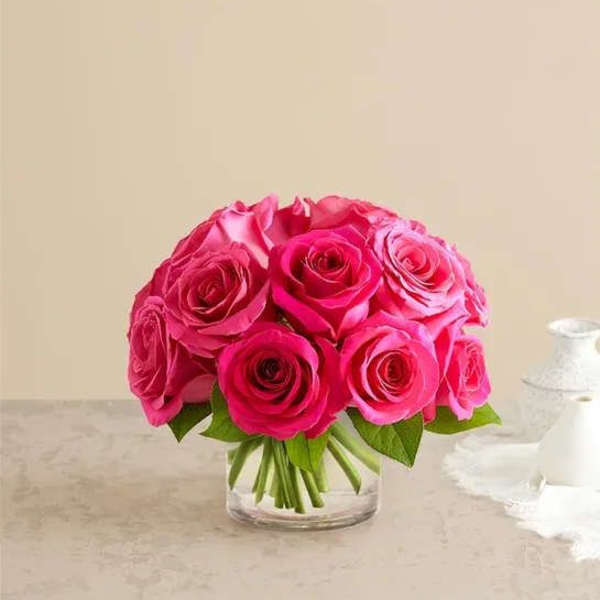 Pink rose bouquet in a clear glass vase