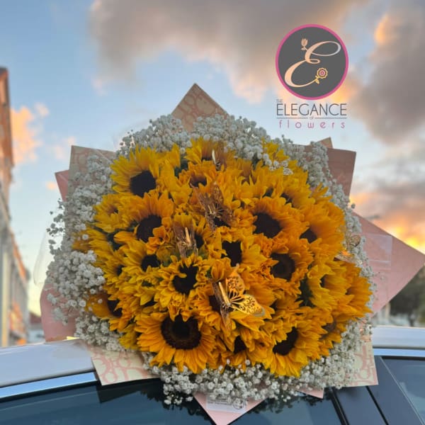 Large bouquet of yellow sunflowers with white baby's breath