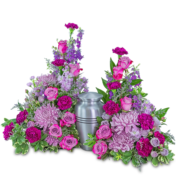 Two pink and purple floral sprays flank a silver urn