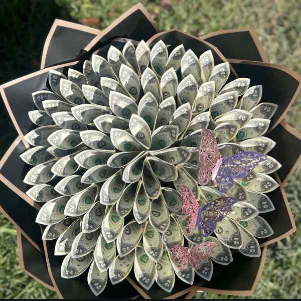 Bouquet made of folded dollar bills with butterfly decorations