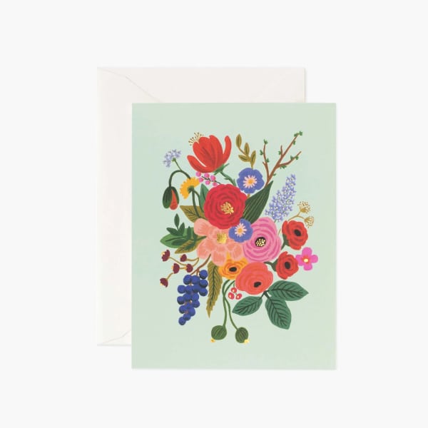 Floral greeting card with a colorful bouquet illustration on a pale green front